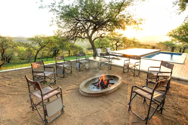 Sit around the fire at Mavela Game Lodge